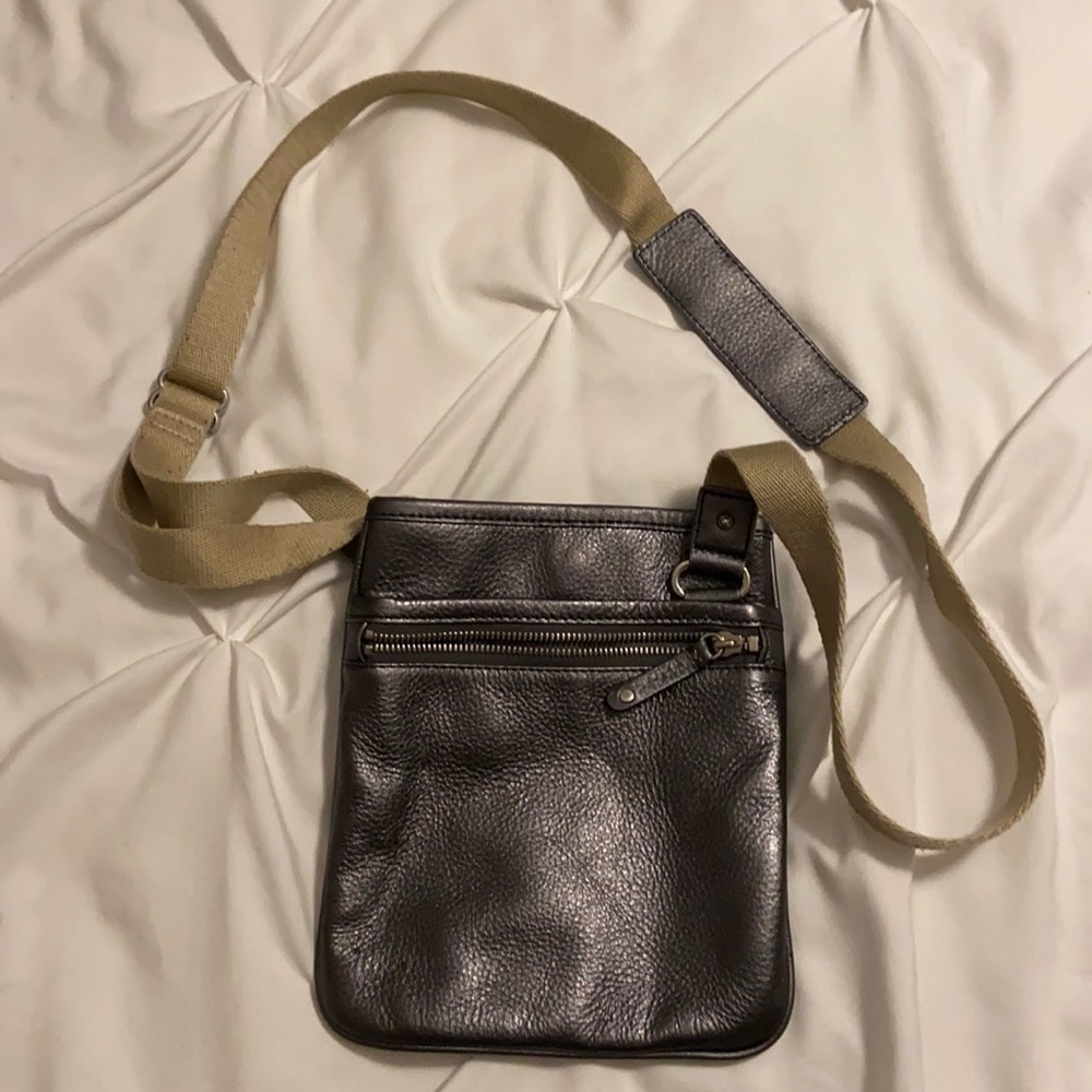 MICHAEL KORS silver metallic cross body purse.